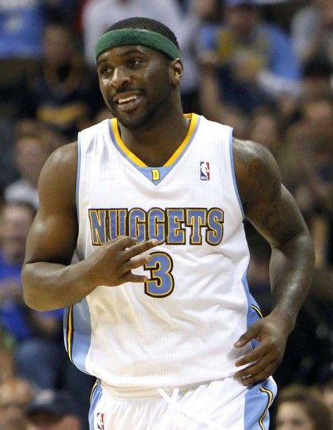 Denver Nuggets guard Ty Lawson celebrates a three-point shot in their NBA basketball game against the Minnesota Timberwolves in Denver April 9, 2011. REUTERS/Rick Wilking   (UNITED STATES - Tags: SPORT BASKETBALL)