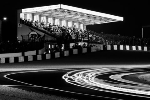 LE MANS, FRANCE - JUNE 14:  (EDITORS NOTE: THIS BLACK AND WHITE IMAGE WAS CREATED FROM ORIGINAL COLOUR FILE) Cars go through the Dunlop Bridge chicane during the 76th running of the Le Mans 24 Hour race at the Circuit des 24 Heures du Mans on June 14, 2008 in Le Mans, France.  (Photo by Mike Hewitt/Getty Images)