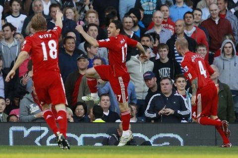 Liverpool's Maxi Rodriguez (C) celebrates his goal against Fulham with Dirk Kuyt (L) and Raul Meireles during their English Premier League soccer match at Craven Cottage in London May 9, 2011. REUTERS/Eddie Keogh. (BRITAIN - Tags: SPORT SOCCER) NO ONLINE/INTERNET USAGE WITHOUT A LICENCE FROM THE FOOTBALL DATA CO LTD. FOR LICENCE ENQUIRIES PLEASE TELEPHONE ++44 (0) 207 864 9000