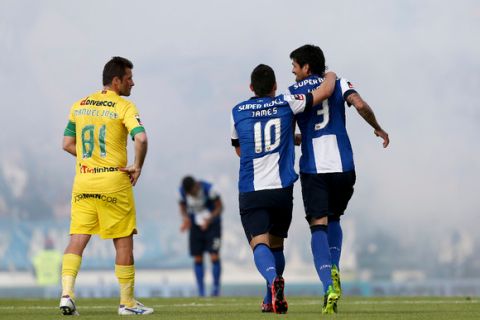 FC Porto's Lucho González (R) and James Rodriguez celebrate after scoring a goal against Paços de Ferreira during the Portuguese First League soccer match, held at Mata Real stadium in Paços de Ferreira, Portugal, 19 May 2013. ESTELA SILVA/LUSA