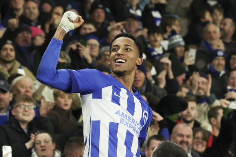 Brighton's Joao Pedro, top, celebrates scoring his side's opening goal during the Europa League Group B soccer match between Brighton and Hove Albion and Olympique de Marseille at the Amex stadium in Brighton, England, Thursday, Dec. 14, 2023. (AP Photo/Ian Walton)