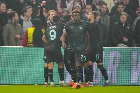 Lazio players celebrate after scoring the opening goal during the Europa League soccer match between Ajax and Lazio Roma at the Johan Cruyff Arena in Amsterdam, Netherlands, Thursday, Dec. 12, 2024. (AP Photo/Peter Dejong)