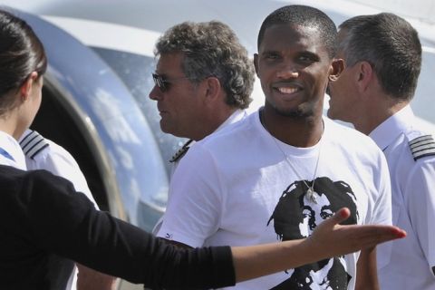 Cameroon football star Samuel Eto'o is welcomed upon arrival at Vnukovo airport in Moscow on August 25, 2011. Samuel Eto'o arrived today after signing a three-year deal with Russia's new big spenders Anzhi Makhachkala that will reportedly be the most valuable contract in football. "This evening, Inter Milan striker Samuel Eto'o signed a personal three-year contract with Anzhi Makhachkala," the club said in a statement issued after Eto'o completed a medical on Wednesday evening. AFP PHOTO/ STR (Photo credit should read STR/AFP/Getty Images)