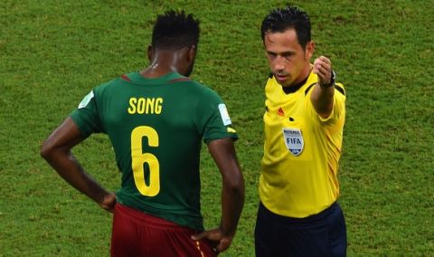 MANAUS, BRAZIL - JUNE 18:  Alex Song of Cameroon is sent off after a red card by referee Pedro Proenca during the 2014 FIFA World Cup Brazil Group A match between Cameroon and Croatia at Arena Amazonia on June 18, 2014 in Manaus, Brazil.  (Photo by Stu Forster/Getty Images)