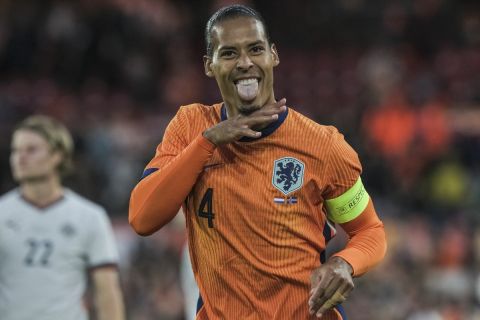 Netherlands' Virgil van Dijk celebrates scoring his side's 2nd goal during the international friendly soccer match between The Netherlands and Iceland at De Kuip stadium in Rotterdam, Netherlands, Monday, June 10, 2024. (AP Photo/Patrick Post)