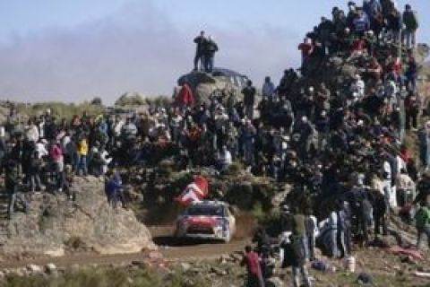 Sebastien Loeb of France and his co-driver Daniel Elena of Monte Carlo steer their Citroen C4 during the 12th special stage of the second day of the WRC Argentina Rally in El Condor, Argentina, Saturday, April 25, 2009. (AP Photo/Eduardo Di Baia)