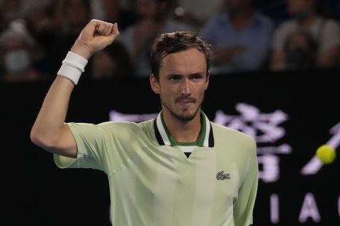 Daniil Medvedev of Russia reacts after scoring a point against Rafael Nadal of Spain during the men's singles final at the Australian Open tennis championships in Melbourne, Australia, Sunday, Jan. 30, 2022. (AP Photo/Simon Baker)