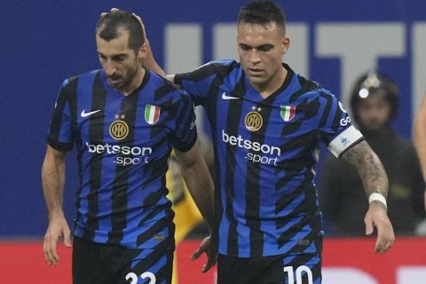 Inter Milan's Henrikh Mkhitaryan, left, celebrates with Inter Milan's Lautaro Martinez after scoring his side's second goal during a Serie A soccer match between Inter Milan and Juventus at the San Siro stadium in Milan, Italy, Sunday, Oct. 27, 2024. (AP Photo/Luca Bruno)