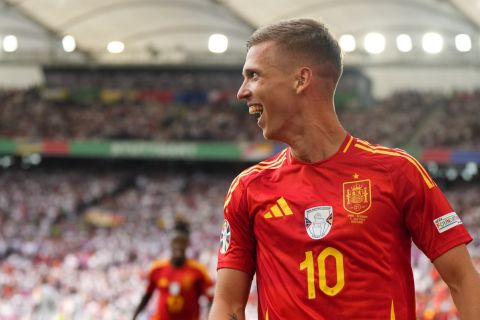 Spain's Dani Olmo smiles after scoring his sides first goal during a quarter final match between Germany and Spain at the Euro 2024 soccer tournament in Stuttgart, Germany, Friday, July 5, 2024. (AP Photo/Manu Fernandez)