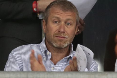 Chlelsea owner Roman Abramovich applauds  during the Euro 2012 soccer championship quarterfinal match between England and Italy in Kiev, Ukraine, Sunday, June 24, 2012. (AP Photo/Ivan Sekretarev) 