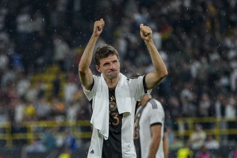 Germany's Thomas Muller gestures to supporters at the end of the international friendly soccer match between Germany and France in Dortmund, Germany, Tuesday, Sept. 12, 2023. Muller scored once in Germany's 2-1 victory. (AP Photo/Martin Meissner)