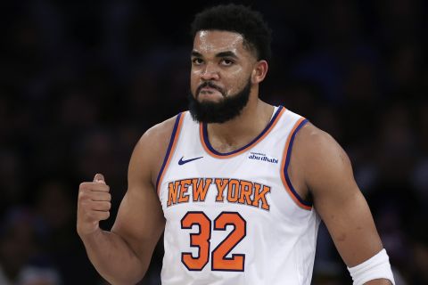 New York Knicks center Karl-Anthony Towns (32) reacts during the first half of an NBA basketball game against the Toronto Raptors Monday, Dec. 23, 2024, in New York. The Knicks won 139-125. (AP Photo/Adam Hunger)