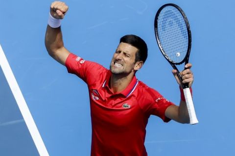 Serbia's Novak Djokovic celebrates after defeating Canada's Denis Shapovalov in their ATP Cup match in Melbourne, Australia, Tuesday, Feb. 2, 2021. (AP Photo/Hamish Blair)