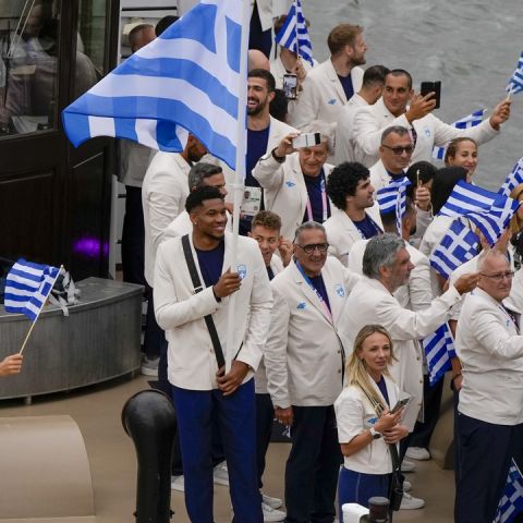 Team Greece travel by boat along the Seine River in Paris, France, during the opening ceremony of the 2024 Summer Olympics, Friday, July 26, 2024. (AP Photo/Matthias Schrader)