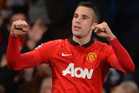 MANCHESTER, ENGLAND - SEPTEMBER 17:  Robin van Persie of Manchester United celebrates scoring his team's second goal during the UEFA Champions League Group A match between Manchester United and Bayer Leverkusen at Old Trafford on September 17, 2013 in Manchester, England.  (Photo by Michael Regan/Getty Images)