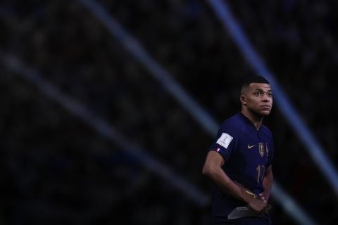 France's Kylian Mbappe holds the Golden Boot award for top goalscorer of the tournament at the end of the World Cup final soccer match between Argentina and France at the Lusail Stadium in Lusail, Qatar, Sunday, Dec.18, 2022. (AP Photo/Manu Fernandez)