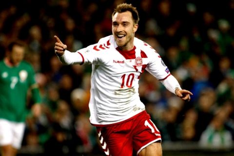 FILE - In this Tuesday, Nov. 14, 2017 filer, Denmark's Christian Eriksen celebrates after scoring his side's third goal during the World Cup qualifying play off second leg soccer match between Ireland and Denmark at the Aviva Stadium in Dublin. (AP Photo/Peter Morrison, File)