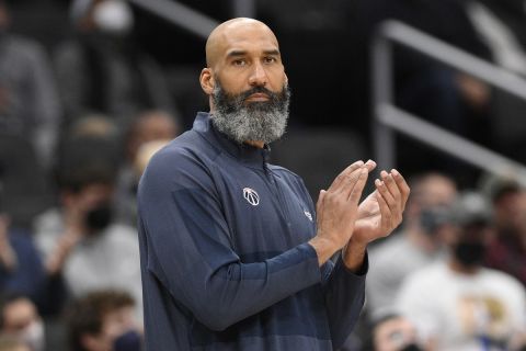 Washington Wizards acting head coach Joseph Blair reacts during the first half of an NBA basketball game against the Philadelphia 76ers, Monday, Jan. 17, 2022, in Washington. (AP Photo/Nick Wass)