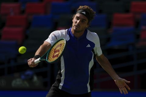 Stefanos Tsitsipas of Greece plays a backhand return against Alexandre Muller of France during the men's singles third round match in the Shanghai Masters tennis tournament at Qizhong Forest Sports City Tennis Center in Shanghai, China (AP Photo/Andy Wong)