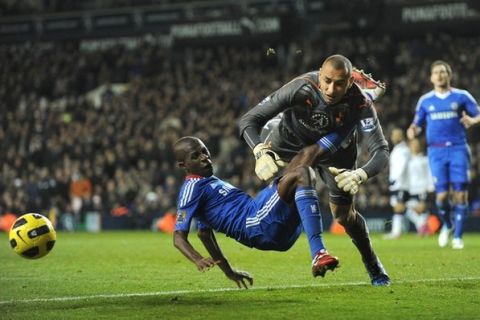 Tottenham Hotspurs' Brazilian goalkeeper Heurelho Gomes (2nd R) fouls Chelsea's Ramires (L) to concede a penalty during the Premiership football match at White Hart Lane in London on December 12, 2010. Gomes saved the penalty from Didier Drogba and the game ended 1-1. AFP PHOTO / Adrian DennisFOR EDITORIAL USE ONLY Additional licence required for any commercial/promotional use or use on TV or internet (except identical online version of newspaper) of Premier League/Football League photos. Tel DataCo +44 207 2981656. Do not alter/modify photo. (Photo credit should read ADRIAN DENNIS/AFP/Getty Images)