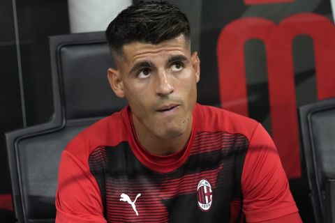 AC Milan's Alvaro Morata sits in the bench prior to the start of the Serie A soccer match between AC Milan and Torino at the San Siro stadium, in Milan, Italy, Saturday, Aug. 17, 2024. (AP Photo/Antonio Calanni)