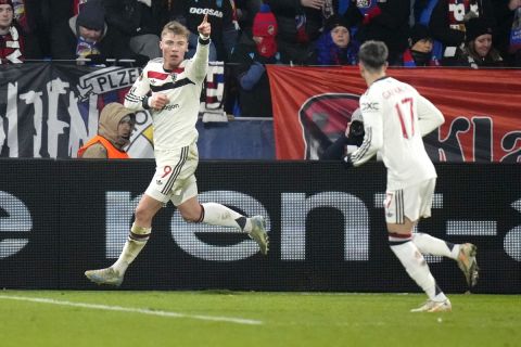 Manchester United's Rasmus Hojlund, left, celebrates after scoring during the Europa League soccer match between Viktoria Plzen and Manchester United at the Doosan Arena in Plzen, Czech Republic, Thursday, Dec. 12, 2024. (AP Photo/Petr David Josek)