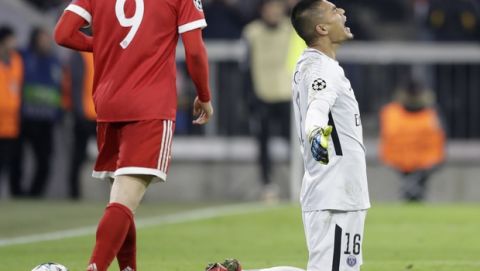 PSG goalkeeper Alphonse Areola reacts after Bayern scored their third goal during the Champions League Group B soccer match between FC Bayern Munich and Paris Saint-Germain, at Allianz Arena stadium in Munich, Germany, Tuesday, Dec. 5, 2017. (AP Photo/Matthias Schrader)