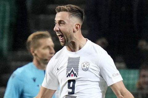 Slovenia's Andraz Sporar, centre, celebrates scoring his side's first goal during the UEFA Nations League soccer match between Slovenia and Norway at the Stozice stadium in Ljubljana, Slovenia, Saturday, Sept. 24, 2022. (AP Photo/Darko Bandic)