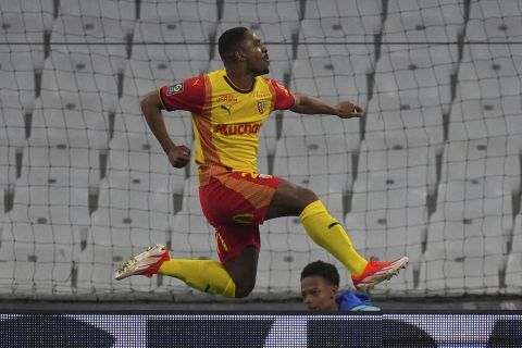 Lens' Wesley Said celebrates after scoring his side's opening goal during a French League One soccer match between Marseille and Lens at the Stade Velodrome stadium in Marseille, France, Sunday, April 28, 2024. (AP Photo/Daniel Cole)