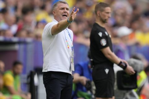 Ukraine's head coach Serhiy Rebrov gestures during a Group E match between Romania and Ukraine at the Euro 2024 soccer tournament in Munich, Germany, Monday, June 17, 2024. (AP Photo/Antonio Calanni)