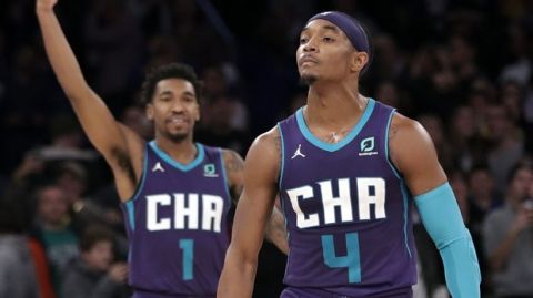 Charlotte Hornets' Devonte' Graham (4) and teammate Malik Monk (1) react after Graham made a 3-point basket during the second half of an NBA basketball game against the New York Knicks, Saturday, Nov. 16, 2019, in New York. The Hornets won 103-102. (AP Photo/Frank Franklin II)