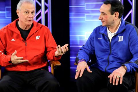 Wisconsin head coach Bo Ryan and Duke head coach Mike Krzyzewski talk during a CBS Sports interview for the NCAA Final Four college basketball tournament championship game Sunday, April 5, 2015, in Indianapolis. (AP Photo/David J. Phillip)