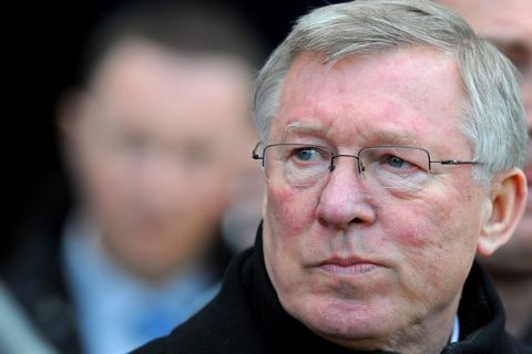 Manchester United's Scottish manager Sir Alex Ferguson looks on before the English Premier League football match between Wigan Athletic and Manchester United at The DW Stadium, Wigan, north-west England on February 26, 2011. AFP PHOTO/ANDREW YATESFOR EDITORIAL USE ONLY Additional licence required for any commercial/promotional use or use on TV or internet (except identical online version of newspaper) of Premier League/Football League photos. Tel DataCo +44 207 2981656. Do not alter/modify photo. (Photo credit should read ANDREW YATES/AFP/Getty Images)