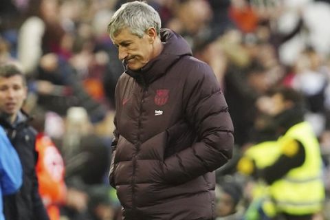 Barcelona's head coach Quique Setien stands during the Spanish La Liga soccer match between Valencia and Barcelona at the Mestalla Stadium in Valencia, Spain, Saturday, Jan. 25, 2020. (AP Photo/Alberto Saiz)