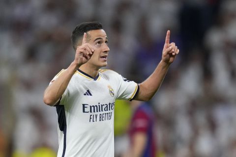 Real Madrid's Lucas Vazquez celebrates after scoring his side's second goal during the Spanish La Liga soccer match between Real Madrid and Barcelona at the Santiago Bernabeu stadium in Madrid, Spain, Sunday, April 21, 2024. (AP Photo/Manu Fernandez)