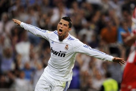 MADRID, SPAIN - MAY 21:  Cristiano Ronaldo of Real Madrid celebrates after scoring his 2nd goal during the La Liga match between Real Madrid and UD Almeria at Estadio Santiago Bernabeu on May 21, 2011 in Madrid, Spain.  (Photo by Denis Doyle/Getty Images)