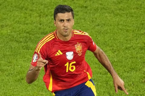 Spain's Rodri celebrates after scoring his side's opening goal during a round of sixteen match against Georgia at the Euro 2024 soccer tournament in Cologne, Germany, Sunday, June 30, 2024. (AP Photo/Andreea Alexandru)