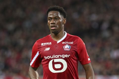 Lille's Jonathan David reacts during the French League One soccer match between Lille and Marseille at the Pierre Mauroy stadium in Villeneuve d'Ascq, northern France, Friday, April 5, 2024. (AP Photo/Matthieu Mirville)