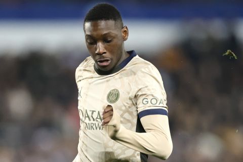 PSG's Randal Kolo Muani, centre, in action during a French League One soccer match between Strasbourg and Paris Saint-Germain at Stade de la Meinau stadium in Strasbourg, France, Friday, Feb. 2, 2024. (AP Photo/Jean-Francois Badias)