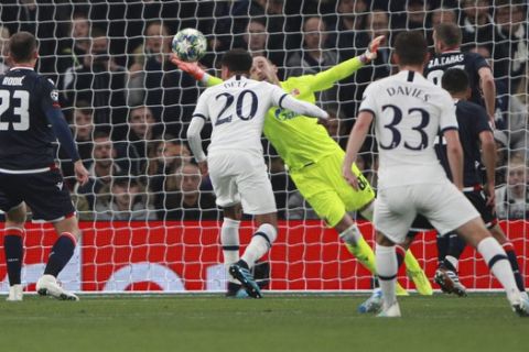 Red Star's goalkeeper Milan Borjan fails to save a shot by Tottenham's Harry Kane during the Champions League, group B, soccer match between Tottenham and Red Star Belgrade, at the Tottenham Hotspur stadium in London, Tuesday, Oct. 22, 2019. (AP Photo/Ian Walton)