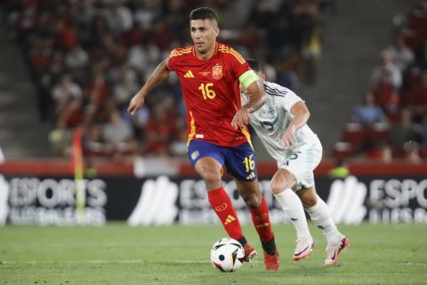 Spain's Rodri dribbles the ball during the international friendly soccer match between Spain and Northern Ireland at the Son Moix stadium in Palma de Mallorca, Spain, Saturday, June 8, 2024. (AP Photo/Francisco Ubilla)