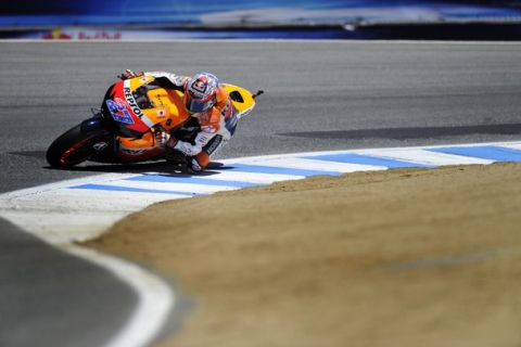 Honda MotoGP rider Casey Stoner of Australia leans into the top of the "Corkscrew" turn during the championship race of the U.S. Grand Prix at Mazda Raceway Laguna Seca in Monterey, California July 24, 2011. REUTERS/Chad Ziemendorf (UNITED STATES - Tags: SPORT MOTOR RACING)