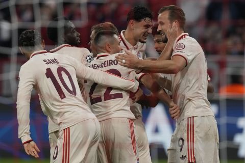 Bayern's Harry Kane, right is congratulated by teammates after scoring his side 6th goal and complete his hat-trick from the penalty spot during the Champions League opening phase soccer match between Bayern Munich and GNK Dinamo at the Allianz Arena in Munich, Germany Tuesday, Sept. 17, 2024. (AP Photo/Matthias Schrader)