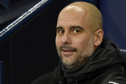 Manchester City's head coach Pep Guardiola during the English Premier League soccer match between Manchester City and Chelsea at Etihad stadium in Manchester, England, Saturday, Nov. 23, 2019. (AP Photo/Rui Vieira)