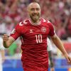 Denmark's Christian Eriksen celebrates after scoring the opening goal of the game during a Group C match between Slovenia and Denmark at the Euro 2024 soccer tournament in Stuttgart, Germany, Sunday, June 16, 2024. (AP Photo/Matthias Schrader)