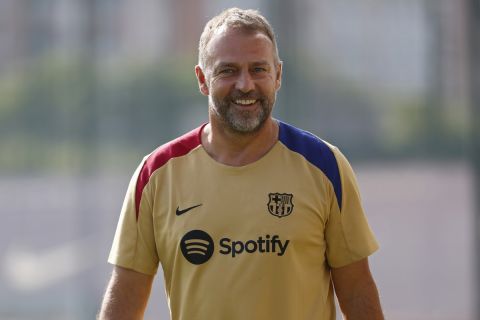 Barcelona's new coach Hansi Flick takes part in a pre-season training session in Barcelona, Spain, Friday, July 19, 2024. (AP Photo/Joan Monfort)