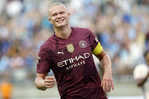 Manchester City's Erling Haaland smiles as he celebrates his second half goal against Chelsea during an FC Series soccer match, Saturday, Aug. 3, 2024 at Ohio Stadium in Columbus, Ohio. (AP Photo/Tom E. Puskar)