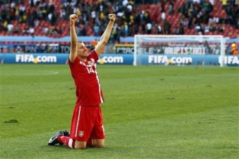 Serbia's Milan Jovanovic celebrates his side's 1-0 win at the end of the World Cup group D soccer match between Germany and Serbia at Nelson Mandela Bay Stadium in Port Elizabeth, South Africa, Friday, June 18, 2010.  (AP Photo/Darko Vojinovic)