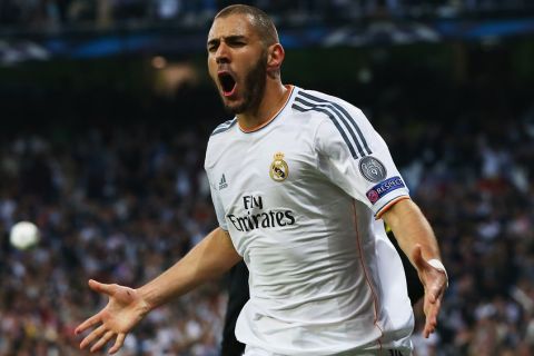 MADRID, SPAIN - APRIL 23:  Karim Benzema of Real Madrid celebrates scoring the opening goal during the UEFA Champions League semi-final first leg match between Real Madrid and FC Bayern Muenchen at the Estadio Santiago Bernabeu on April 23, 2014 in Madrid, Spain.  (Photo by Martin Rose/Bongarts/Getty Images)