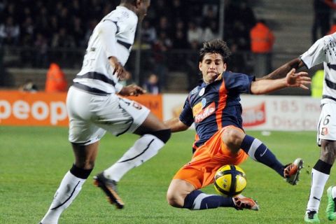 Montpellier's Marco Estrada (L) vies with Rennes's Abdoulrazak Boukari (R) during their French L1 football match Montpellier vs Rennes on March 5, 2011 at the Mosson stadium in Montpellier, southern France. AFP PHOTO/GERARD JULIEN</CPT> (Photo credit should read GERARD JULIEN/AFP/Getty Images)